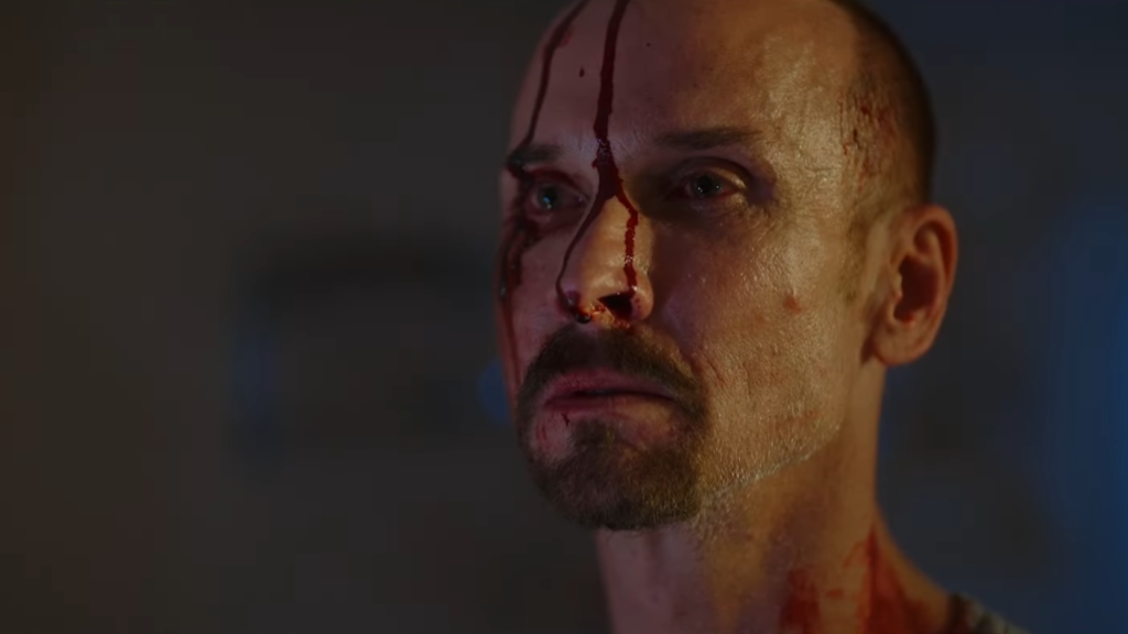 The Pale Face Killer Terrifies Victims in the He Never Left Trailer